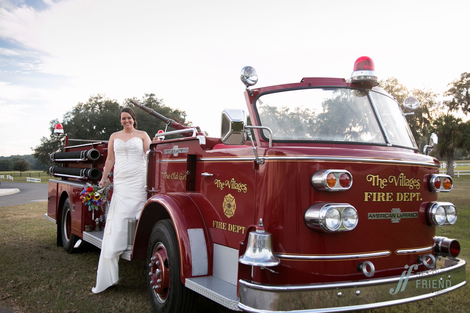 Bride on Firetruck. photos by www.jessicafriendphotodesign.com