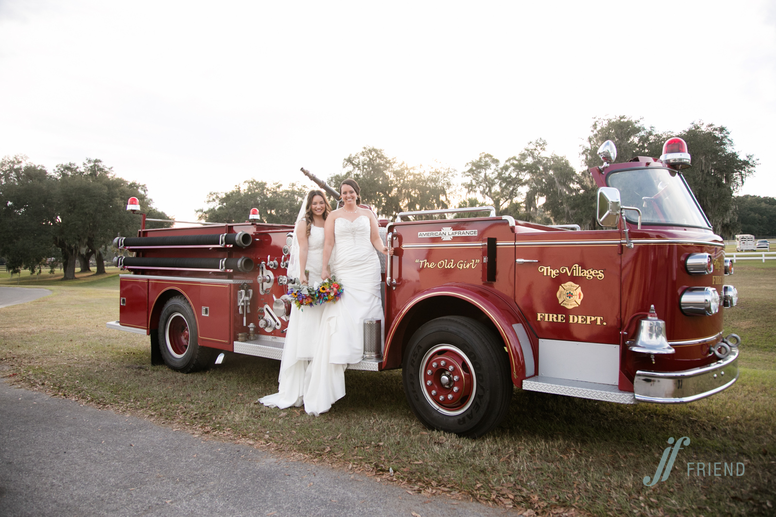 Brides on firetruck. photos by www.jessicafriendphotodesign.com